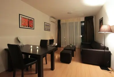 a living room with a dining room table and a couch at Charming 1 Bedroom Apartment for up to 4 Guests in Sunny Beach