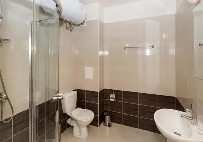 a bathroom with a toilet and a sink and a shower at Charming 1 Bedroom Apartment for up to 4 Guests in Sunny Beach