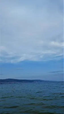 a large body of water with a blue sky at Апартаменты Aphrodite Roce in Sunny Beach