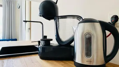a black and silver blender sitting on the floor at APARTELLO ARTUR - Modern Studios - Sveti Vlas in Sveti Vlas