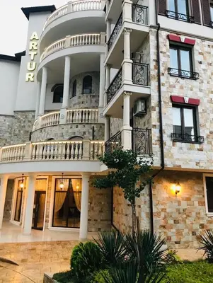a large stone building with balconies on it at APARTELLO ARTUR - Modern Studios - Sveti Vlas in Sveti Vlas