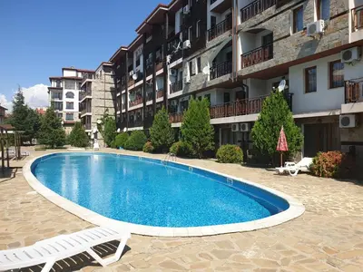 a swimming pool in front of a apartment building at MitProt luks studio Panorama Bay 2 ap39 in Sveti Vlas