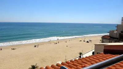 a view of a beach with people on it at Seafront Apartment im Obzor Beach Resort in Obzor