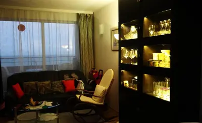 a living room with a couch and chairs and a window at Seafront Apartment im Obzor Beach Resort in Obzor