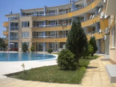 a large building with a swimming pool in front of it at Апартамент с две спални в комплекс Лъки 2 Свети Влас in Sveti Vlas