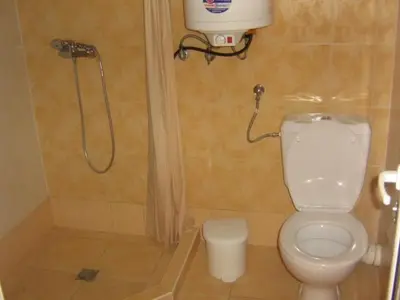 a bathroom with a shower and a toilet at Апартамент с две спални в комплекс Лъки 2 Свети Влас in Sveti Vlas