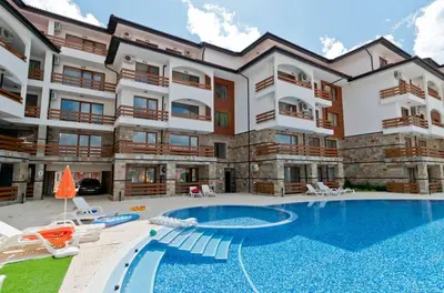 a large apartment building with a swimming pool at Apartamens for rent at the beach bulgaria in Sveti Vlas