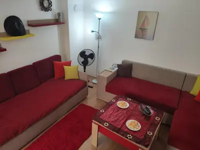 a living room with two couches and a table at Studio Yana *Top location*Sea Garden* in Varna City