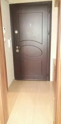 a door in a room with a tile floor at APARTAMENT PRIMERA in Varna City