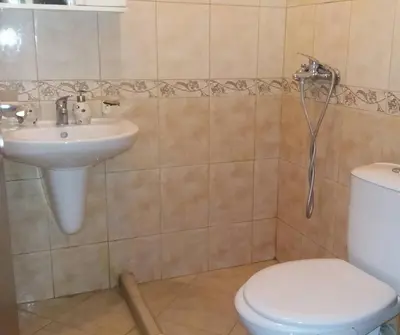 a bathroom with a sink and a toilet at APARTAMENT PRIMERA in Varna City