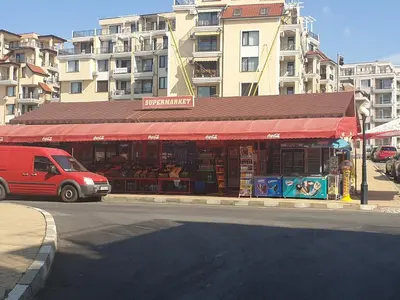 a red van parked in front of a building at Mit Prot luks Apartment Panorama Bay 2 ap109 in Sveti Vlas