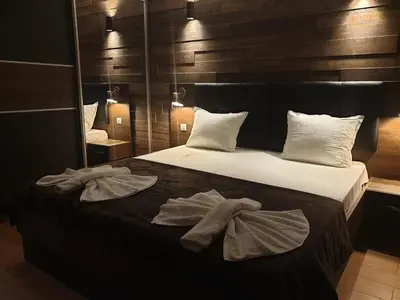 a bedroom with a bed with towels on it at Mit Prot luks Apartment Panorama Bay 2 ap109 in Sveti Vlas