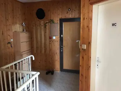 a room with a wooden wall with a door at Апартамент Вангелов in Nesebar