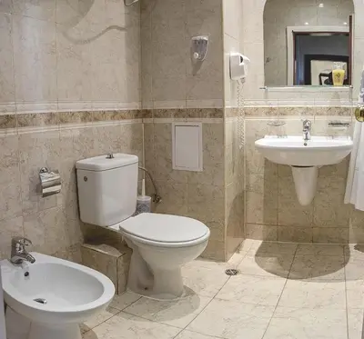 a bathroom with a toilet and a sink at Private Studio in Planet Hotel, Sunny Beach Center by Flаt Manаger in Sunny Beach