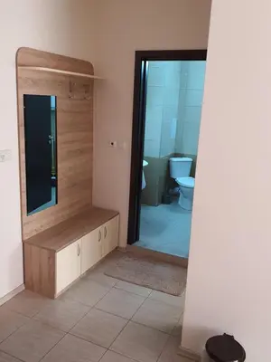 a bathroom with a toilet and a sink and a mirror at Таня 10 in Pomorie