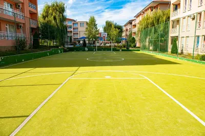 a tennis court in the middle of a building at Sunny Day 6 - Menada Apartments in Sunny Beach