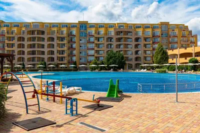 a large building with a large swimming pool with a resort at Menada Grand Resort Apartments in Aheloy