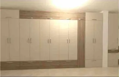 a room with white cabinets and a large mirror at Amazing apartment facing the sea in Burgas City