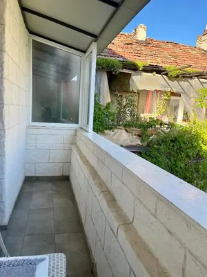 a balcony with a window in a house at Studio Thermi 1 in Varna City