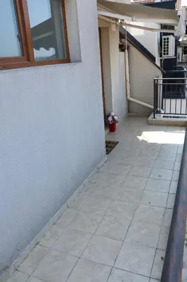 a walkway outside of a house with a window at SEA PANORAMA appartment in Varna City