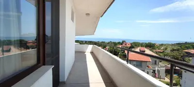 a balcony with a view of a city at Yanevi Apartments in Chernomorets