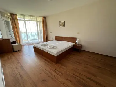 a large bedroom with a bed and a large window at PSB Apartments in Midia Resort Aheloy in Aheloy