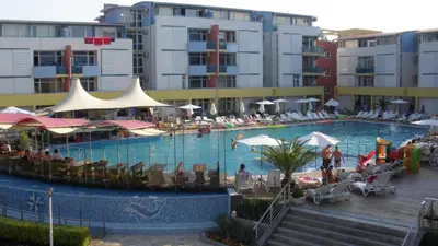 a large swimming pool with people in a hotel at Apartment in Elit 3 Apartcomplex in Sunny Beach