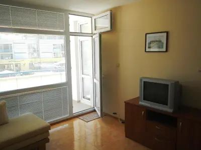 a living room with a tv and a window at Apartment in Elit 3 Apartcomplex in Sunny Beach