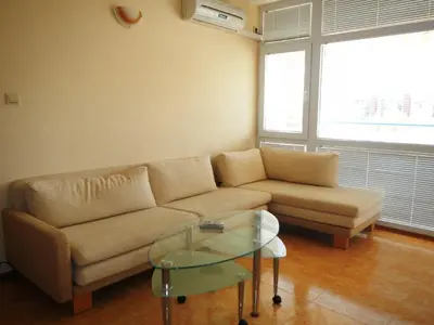 a living room with a couch and a glass table at Apartment in Elit 3 Apartcomplex in Sunny Beach