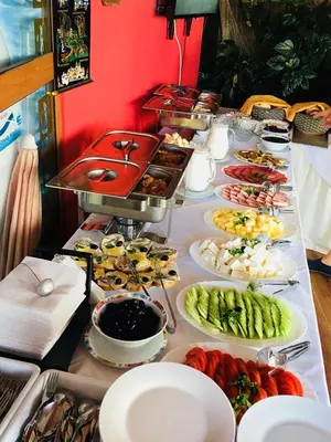 a buffet line with many different types of food at Ribarska Sreshta Family Hotel in Tsarevo