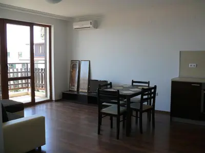 a dining room with a table and chairs in a room at Complex Kentavar - Free Fast WiFi in Sveti Vlas