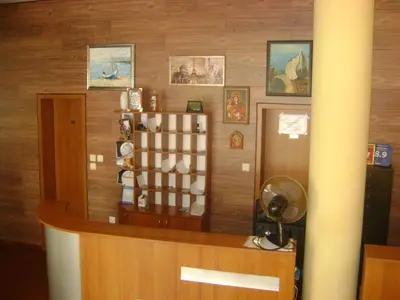 a room with a counter with a shelf of items at Family Hotel Diana in Pomorie