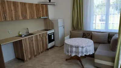 a kitchen with a couch and a table in a room at Complex Argo in Ravda