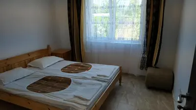 a bed in a room with a window and a bed sidx sidx sidx at Complex Argo in Ravda