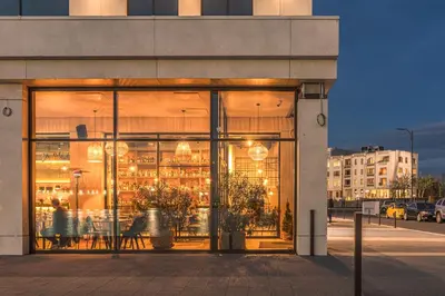 a store front of a building with large glass windows at Marina Burgas Hotel in Burgas City