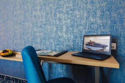 a laptop computer sitting on top of a desk at Marina Burgas Hotel in Burgas City