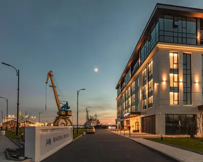 a building with a crane in front of it at Marina Burgas Hotel in Burgas City