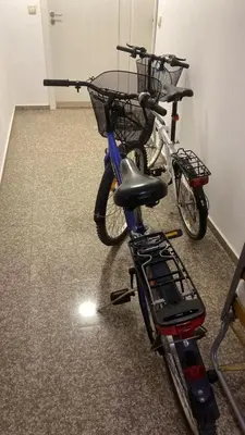 two bikes parked in a room with a basket at Aphrodite Rose in Sunny Beach