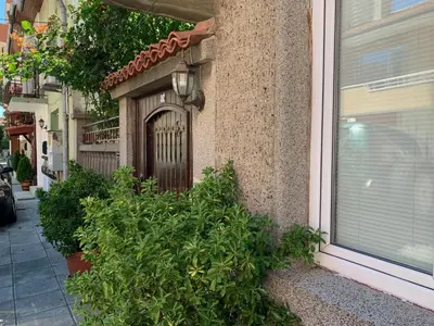 a front door of a house with plants in front of it at Апартамент Катлена in Pomorie