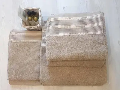 a group of towels and a basket of spoons at Apartment on the sea at St Nikolas Complex-Ira in Chernomorets