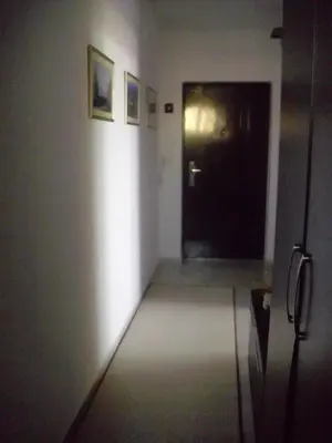 a hallway with a black door in a room at Apartament Villa Del Mare in Primorsko