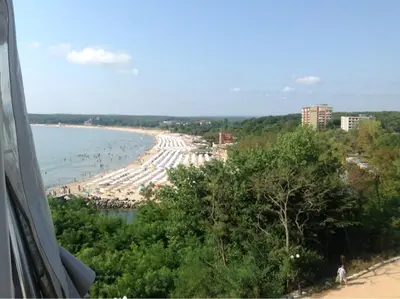 a view of a beach and the ocean at Apartament Villa Del Mare in Primorsko