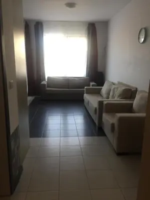 a living room with two couches and a window at Apartment on the sea at St Nikolas Complex-Irina in Chernomorets