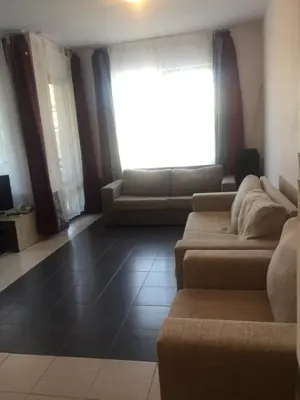 a living room with two couches and a window at Apartment on the sea at St Nikolas Complex-Irina in Chernomorets