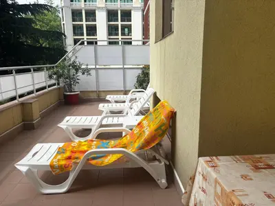a row of lounge chairs on a balcony at Hostel Malibu in Sunny Beach