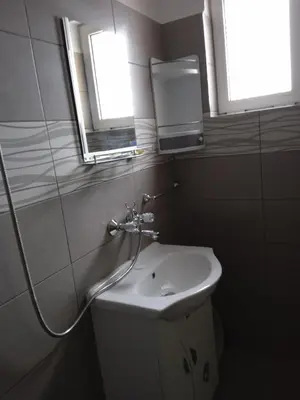 a bathroom with a sink and a mirror at Къща за гости Ганчеви in Sozopol