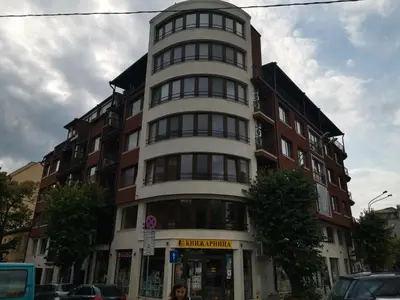 a tall building on the corner of a street at City Center Lux Apartment in Varna City