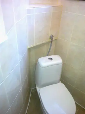 a bathroom with a white toilet in a room at Burgas Urban Studio -Budjet Studio in Burgas City