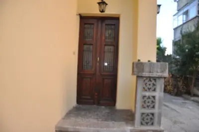 a wooden door on the side of a building at Апартамент ELSOR in Burgas City