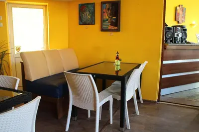 a dining room with a table and chairs at Casablanca City in Varna City